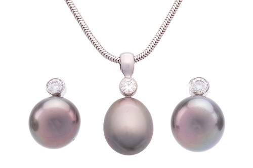 Lot 23 - A cultured Tahitian pearl and diamond pendant...