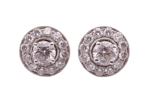 Lot 42 - A pair of diamond stud earrings with...
