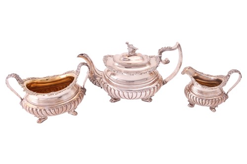 Lot 314 - A George III silver three-piece tea service,...