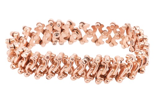Lot 13 - An expandable bracelet, with hinged hollow...
