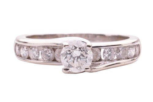 Lot 27 - A diamond solitaire ring, the central round...