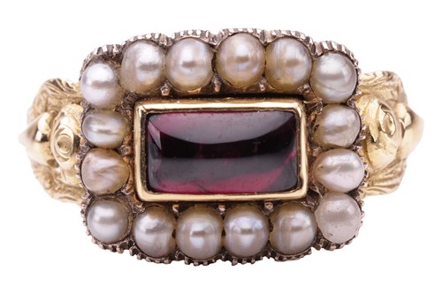 Lot 21 - A Victorian mourning ring set with garnet and...