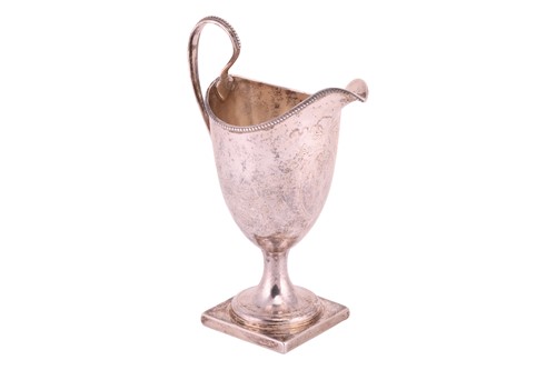 Lot 295 - A George III Newcastle silver helmet cream jug;...