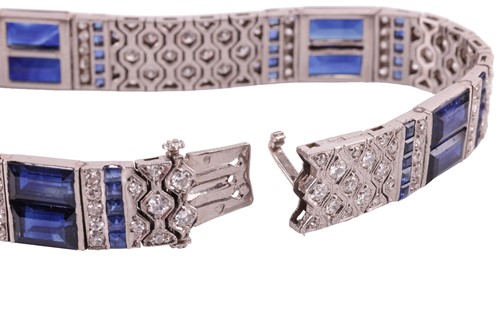 Lot 204 - An Art Deco sapphire and diamond line bracelet...