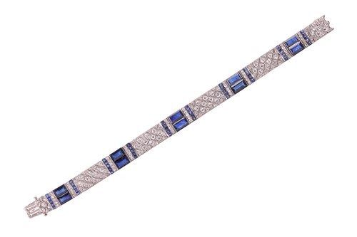Lot 204 - An Art Deco sapphire and diamond line bracelet...