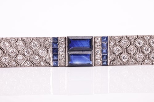 Lot 204 - An Art Deco sapphire and diamond line bracelet...