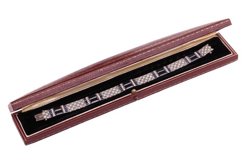 Lot 204 - An Art Deco sapphire and diamond line bracelet...