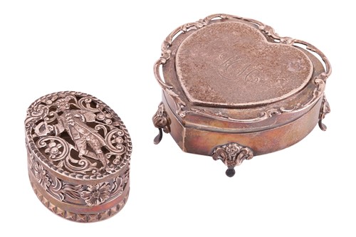 Lot 272 - An Edwardian silver oval box pierced with an...