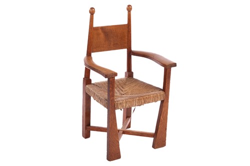 Lot 110 - An Arts & Crafts oak rush-seated child's chair,...
