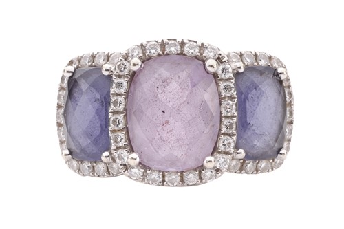 Lot 90 - An amethyst and diamond halo dress ring in...