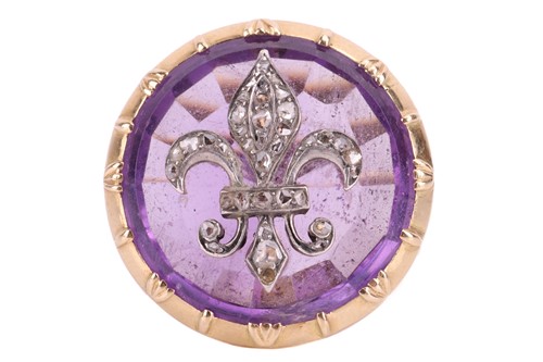 Lot 114 - An amethyst fleur-de-lis cocktail ring, the...