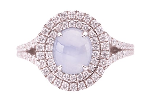Lot 100 - A star sapphire and diamond cluster ring in...