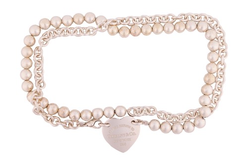 Lot 46 - Tiffany - A 'Return to Tiffany' silver tag...