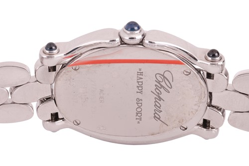 Lot 222 - A Chopard Happy Sport diamond set oval lady's...