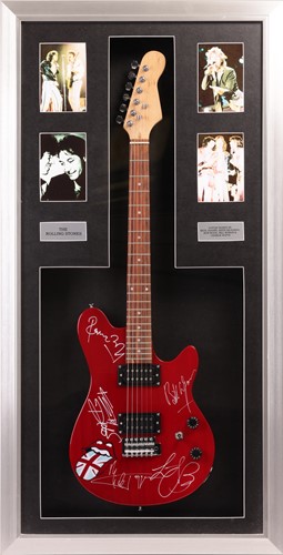 Lot 163 - The Rolling Stones: an electric guitar signed...