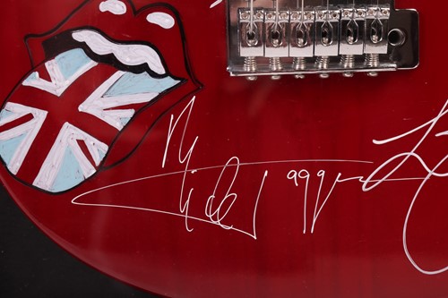 Lot 163 - The Rolling Stones: an electric guitar signed...