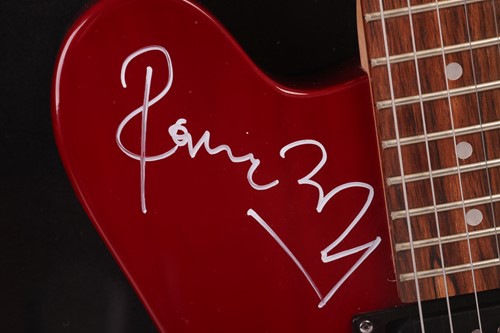 Lot 163 - The Rolling Stones: an electric guitar signed...