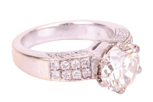 Lot 106 - A diamond solitaire ring with diamond set...