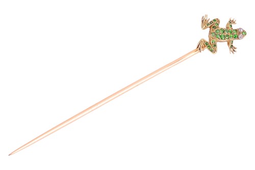 Lot 87 - A demantoid garnet frog stick pin, encrusted...