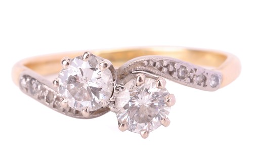 Lot 58 - A diamond two stone cross over ring, featuring...