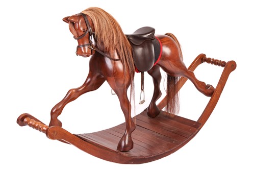 Lot 142 - A large polished mahogany rocking horse, 20th...