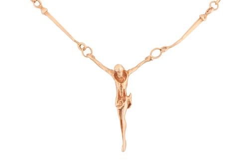 Lot 51 - A crucifix necklace, in yellow metal tested as...