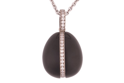 Lot 16 - A Fabergé Whitby jet and diamond egg pendant,...