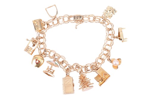 Lot 131 - A charm bracelet with a variety of charms...