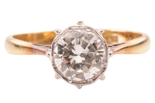 Lot 59 - A diamond set solitaire ring. The principal...