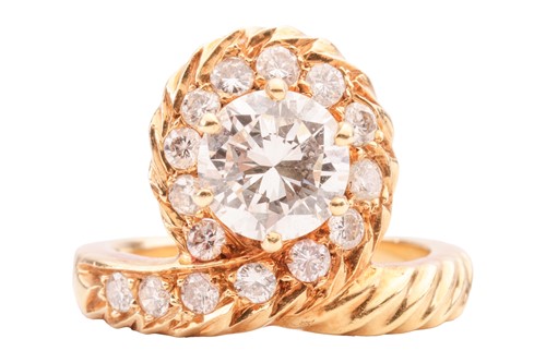 Lot 14 - An asymmetrical diamond-set dress ring,...