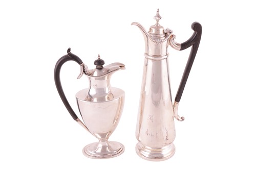 Lot 219 - Two silver wine ewers; to include a tall...