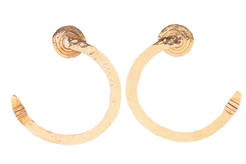 Lot 130 - A pair of abstract, hammered gold hoop...