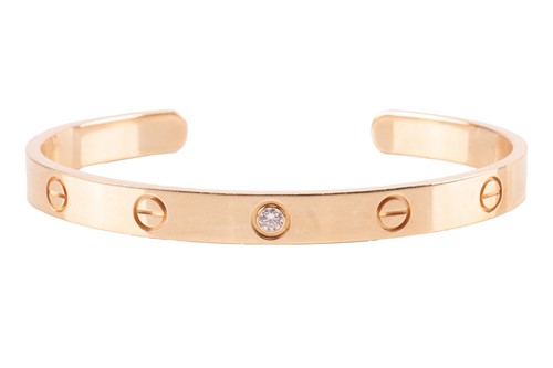 Lot 134 - Cartier - a diamond-set 'Love' cuff bangle in...