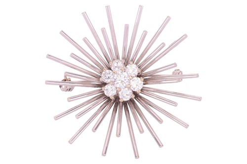 Lot 61 - A diamond cluster starburst brooch, comprising...