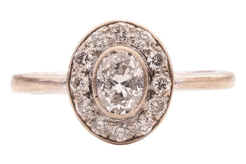 Lot 38 - A diamond cluster ring in 18ct white gold,...