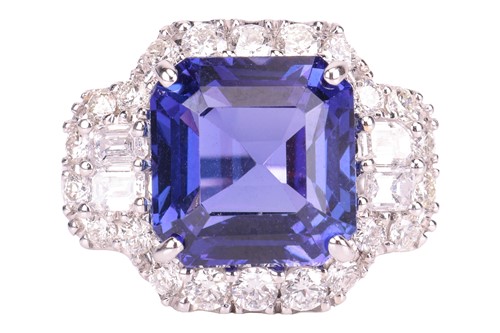 Lot 31 - A tanzanite and diamond cluster ring, centred...