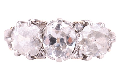 Lot 99 - A diamond three stone ring, designed as a...