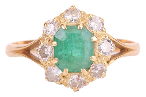 Lot 91 - An emerald and diamond cluster ring in 18ct...