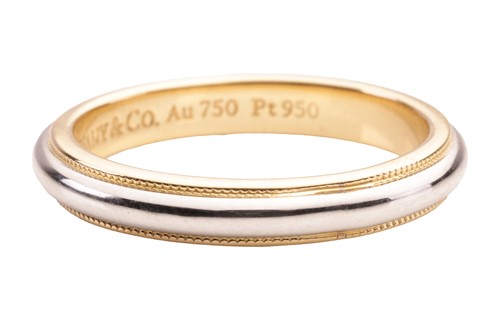 Lot 51 - Tiffany & Co. - a wedding band with millegrain...