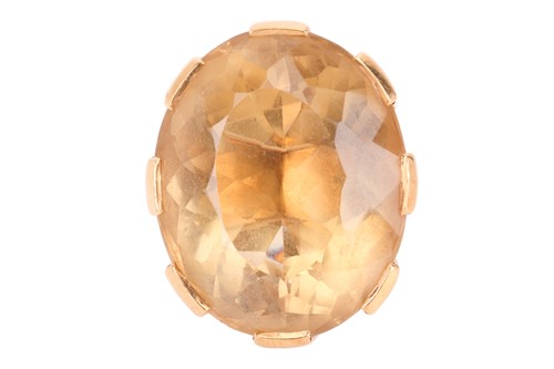 Lot 50 - A large citrine cocktail ring in 18ct yellow...