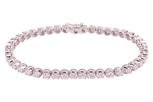 Lot 48 - A diamond-set line bracelet, set with...