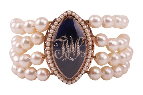 Lot 129 - A George III bracelet with enamel and seed...