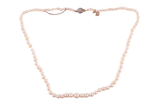 Lot 80 - A single-strand natural pearl necklace with a...