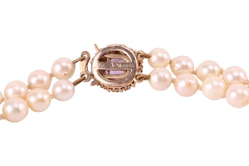 Lot 106 - A double-strand cultured pearl necklace; the...