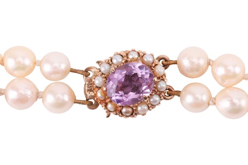 Lot 106 - A double-strand cultured pearl necklace; the...