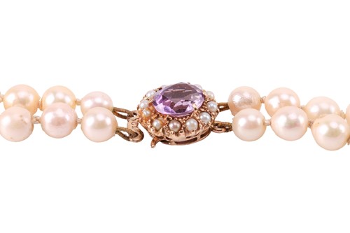 Lot 106 - A double-strand cultured pearl necklace; the...
