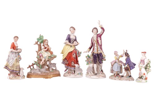 Lot 255 - A porcelain figure of a shepherdess with a...