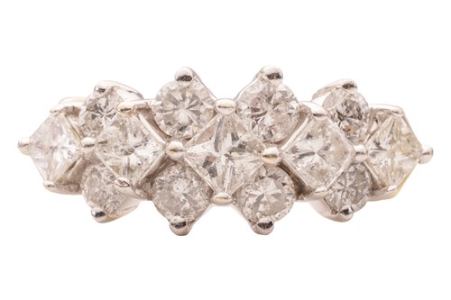 Lot 65 - A diamond-set dress ring, claw-set with a row...