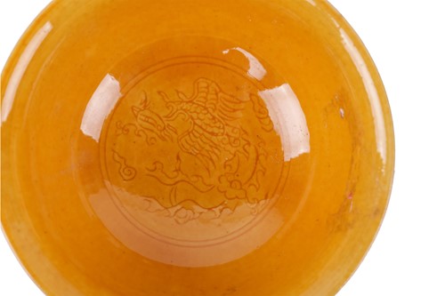 Lot 74 - A Chinese Yellow glazed porcelain stem cup,...