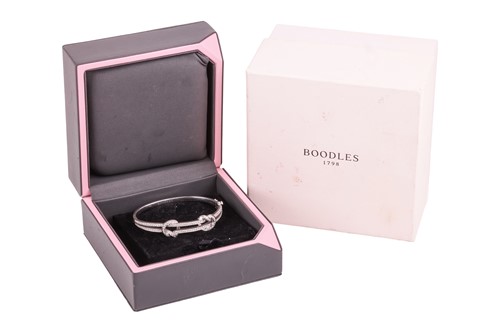 Lot 78 - Boodles - a 'Knot' diamond-set hinged bangle,...